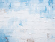 Blue hues and white paint coat a brick wall