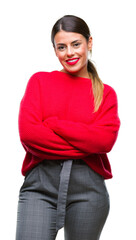 Canvas Print - Young beautiful business woman wearing winter sweater over isolated background happy face smiling with crossed arms looking at the camera. Positive person.