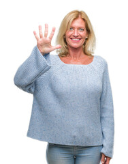 Canvas Print - Middle age blonde woman wearing winter sweater over isolated background showing and pointing up with fingers number five while smiling confident and happy.