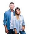© Krakenimages.com - Young couple in love over isolated background with serious expression on face. Simple and natural looking at the camera.