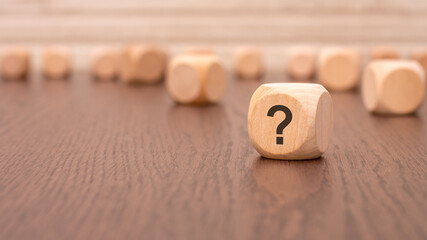 Poster - one wooden block with a question mark and a reflection from the table surface