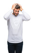 © Krakenimages.com - Young handsome man over isolated background suffering from headache desperate and stressed because pain and migraine. Hands on head.