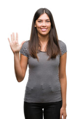 Sticker - Young beautiful hispanic woman showing and pointing up with fingers number five while smiling confident and happy.