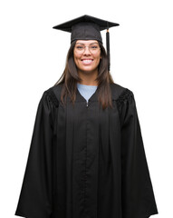 Canvas Print - Young hispanic woman wearing graduated cap and uniform with a happy and cool smile on face. Lucky person.