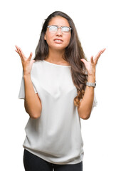 Sticker - Young beautiful arab woman wearing glasses over isolated background crazy and mad shouting and yelling with aggressive expression and arms raised. Frustration concept.