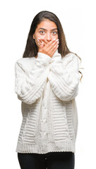 Canvas Print - Young beautiful arab woman wearing winter sweater over isolated background shocked covering mouth with hands for mistake. Secret concept.