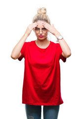 Canvas Print - Young beautiful blonde woman wearing red t-shirt and glasses over isolated background with hand on head for pain in head because stress. Suffering migraine.