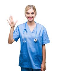 Sticker - Young beautiful blonde doctor surgeon nurse woman over isolated background showing and pointing up with fingers number five while smiling confident and happy.