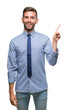© Krakenimages.com - Young handsome business man over isolated background with a big smile on face, pointing with hand and finger to the side looking at the camera.