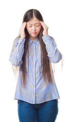 Wall Mural - Young Chinese woman over isolated background with hand on head for pain in head because stress. Suffering migraine.