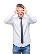 © Krakenimages.com - Young business man wearing glasses over isolated background doing ok gesture like binoculars sticking tongue out, eyes looking through fingers. Crazy expression.