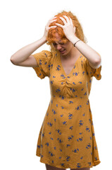 Sticker - Young redhead woman suffering from headache desperate and stressed because pain and migraine. Hands on head.