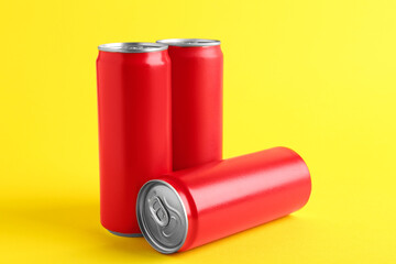 Sticker - Energy drinks in red cans on yellow background