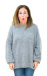 © Krakenimages.com - Beautiful middle age woman wearing winter sweater over isolated background afraid and shocked with surprise expression, fear and excited face.
