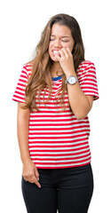 Sticker - Young beautiful brunette woman wearing stripes t-shirt over isolated background looking stressed and nervous with hands on mouth biting nails. Anxiety problem.