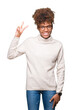 © Krakenimages.com - Beautiful young african american woman wearing glasses over isolated background showing and pointing up with fingers number two while smiling confident and happy.