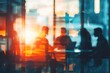 © furyon - silhouettes of diverse people collaborating and working together in a blurred coworking office space teamwork and cooperation concept toned image