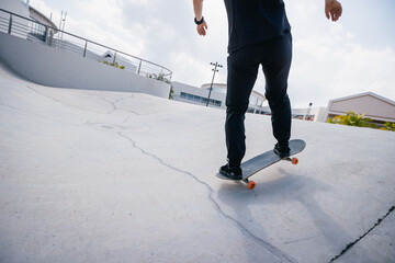 Wall Mural - Skateboarder skateboarding at skatepark in city