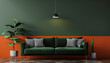 © icon - Dark green sofa, potted plants on orange and dark green walls.
