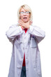Young beautiful blonde doctor woman wearing medical uniform over isolated background shouting and suffocate because painful strangle. Health problem. Asphyxiate and suicide concept.