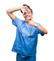 Poster - Young braided hair african american girl professional surgeon over isolated background smiling making frame with hands and fingers with happy face. Creativity and photography concept.