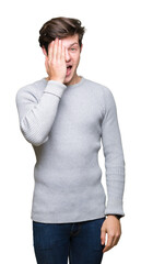 Sticker - Young handsome man wearing winter sweater over isolated background covering one eye with hand with confident smile on face and surprise emotion.