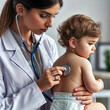 one young woman, in a medical gown, a pediatrician, listens to the baby’s back with a stethoscope