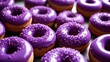  A delightful assortment of purple glazed donuts with sprinkles