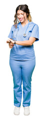 Young adult doctor woman wearing medical uniform Checking the time on wrist watch, relaxed and confident