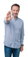 Wall Mural - Handsome middle age elegant senior man over isolated background doing stop sing with palm of the hand. Warning expression with negative and serious gesture on the face.