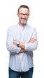 © Krakenimages.com - Middle age hoary senior man wearing glasses over isolated background happy face smiling with crossed arms looking at the camera. Positive person.