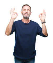 Sticker - Middle age hoary senior man over isolated background relax and smiling with eyes closed doing meditation gesture with fingers. Yoga concept.