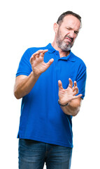 Sticker - Middle age hoary senior man over isolated background disgusted expression, displeased and fearful doing disgust face because aversion reaction. With hands raised. Annoying concept.