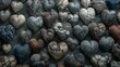   A collection of heart-shaped stones perched atop a multicolored, variegated rock