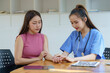 The female doctor examined the patient's health and peace of mind. Basic procedure for general examination, Medical history taking, Physical examination, and Blood test. stomach disease, hypertension.