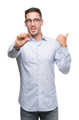 Poster - Handsome young man holding bitcoin pointing with hand and finger up with happy face smiling