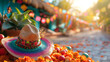 A traditional Mexican sombrero on a bed of marigold flowers with vibrant festival decorations in the background.