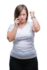 Poster - Young adult woman with down syndrome taking using smartphone over isolated background annoyed and frustrated shouting with anger, crazy and yelling with raised hand, anger concept