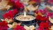   A candle atop a water puddle, encircled by red and gold leaves, with surface water droplets