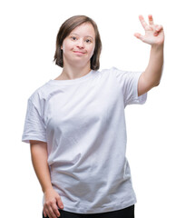 Canvas Print - Young adult woman with down syndrome over isolated background showing and pointing up with fingers number three while smiling confident and happy.