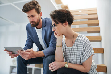 Wall Mural - Colleagues, workplace and tablet for creativity, together and connect for company, business or startup. Female person, man and technology in office on stairs for communication, ideas and vision