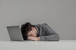 © NomadicPixels - Man Young Sleeping Tired Laptop Exhausted Burnout Work