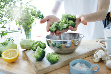 Poster - Young woman cooking food at home