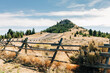 Big Butte mountain with wood fence in Butte, Montana