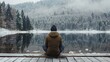 Tranquil Winter Scene: Solitary Man Relaxing on Wooden Deck by the Lake