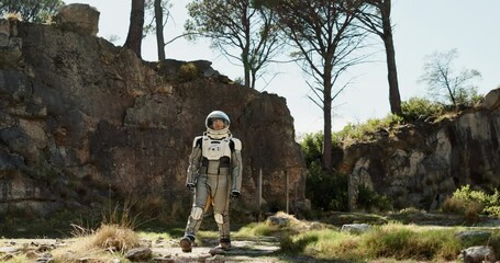 Wall Mural - Planet, travel and astronaut walking in nature to explore abandoned world, planet and universe. Space suit, futuristic fantasy and spaceman in alien environment for exploration, adventure and journey