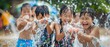 Youth engaging in eco-friendly water games Songkran festival