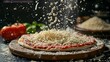 Grated mozzarella cheese gently falling over a tomato pizza base, embodying Italian cuisine