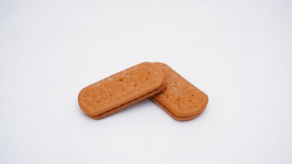 Closeup shot of two cracker biscuits isolated on a white background