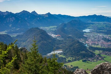 Aerial view of mountain landscape surrounded by dense trees